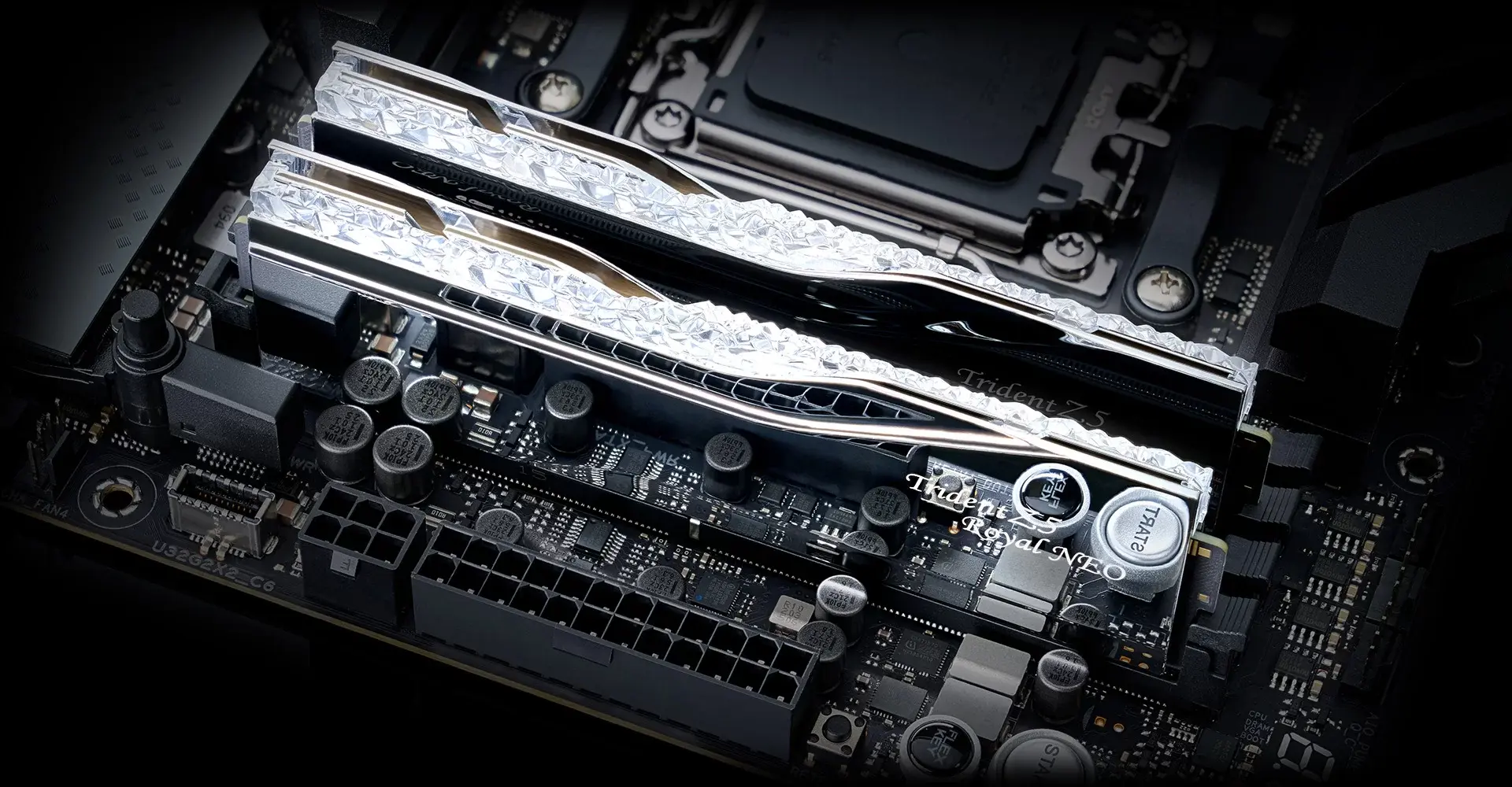 G.SKILL Trident Z5 Royal Neo, silver — Two matching modules are pictured; the motherboard is a presentation prop and is not included.