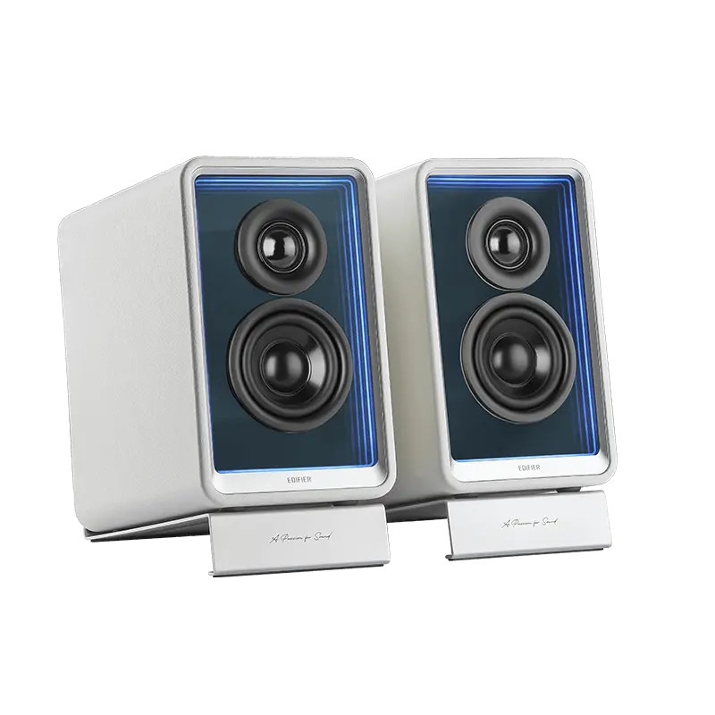 Pair of white Edifier QR65 desktop speakers on their angled aluminium stands, with lit mirrored front baffles