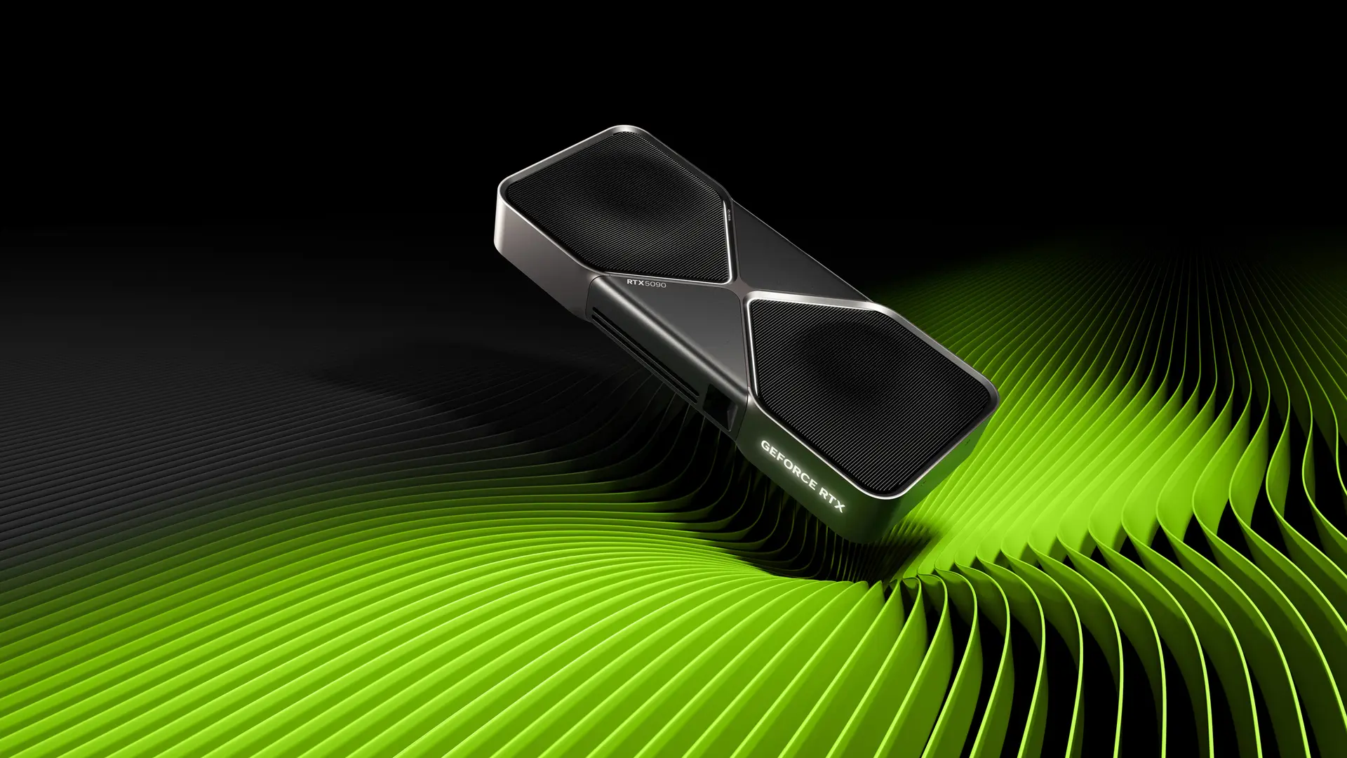 NVIDIA GeForce RTX 5090 Founders Edition black and silver graphics card with its RTX5090 marking, on NVIDIA's green and black promotional background.