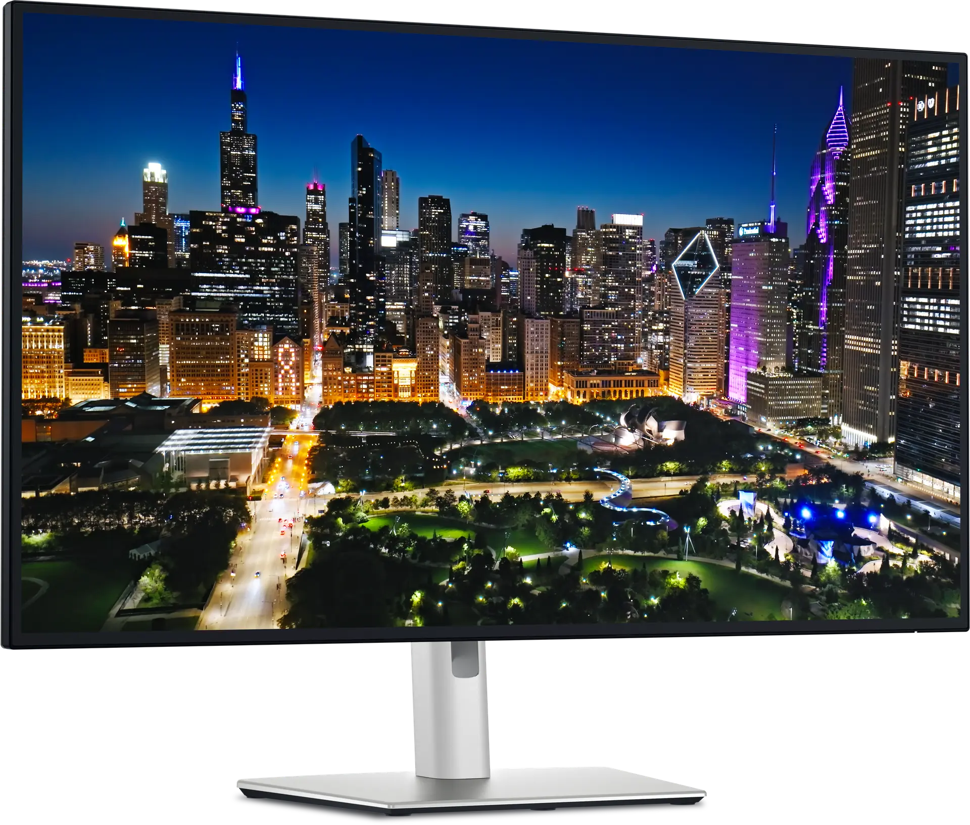 View right-facing An UltraSharp 32 4K Thunderbolt Hub Monitor with an image of a city skyline.
